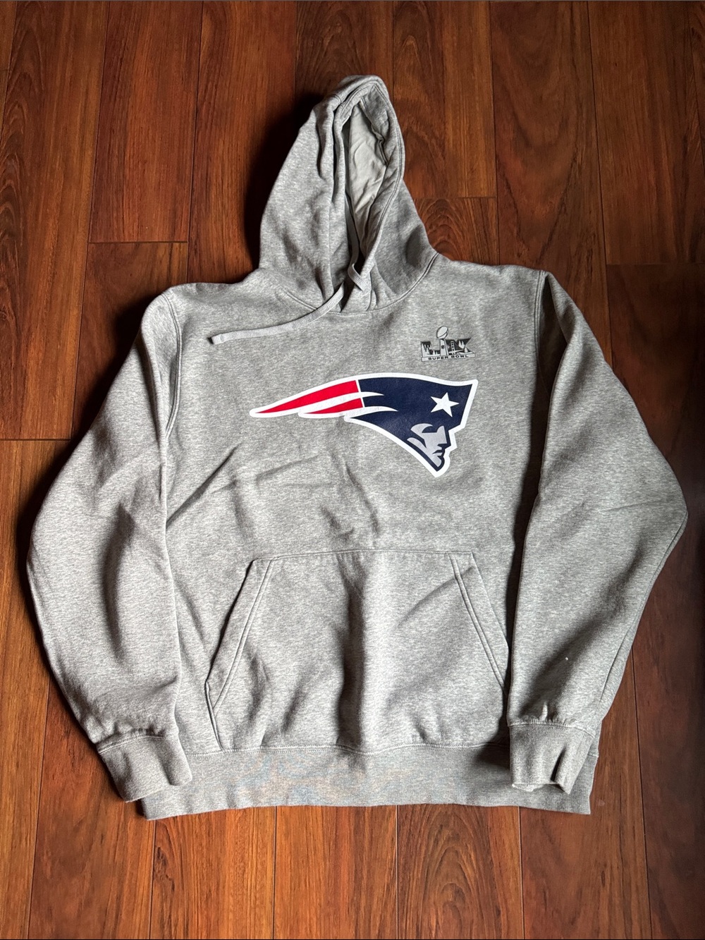 Nike Gray Crewneck Hoodie with New England Patriots logo.